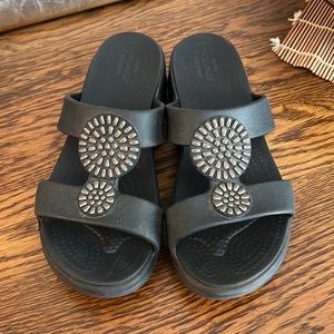 Crocs Sandals, Women’s size 7, Black. Medallion Detail.